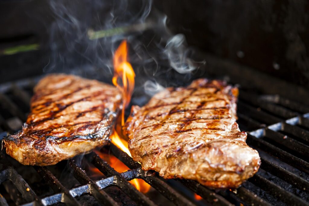 Bbq grills. two steaks on a grill