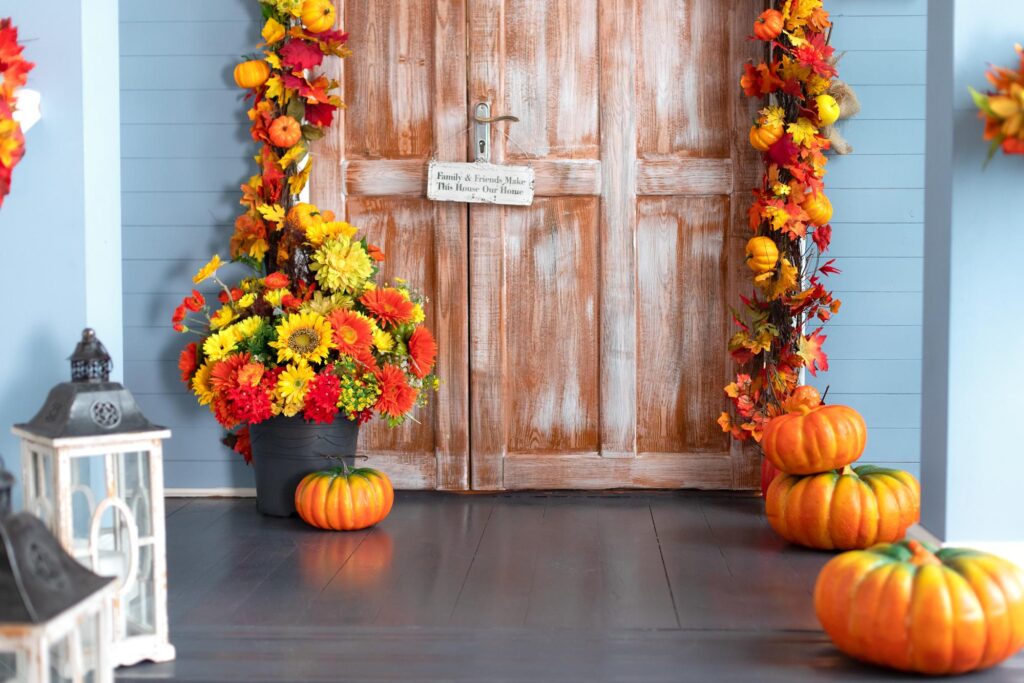 fall home decor with pumpkins and door and fall colors